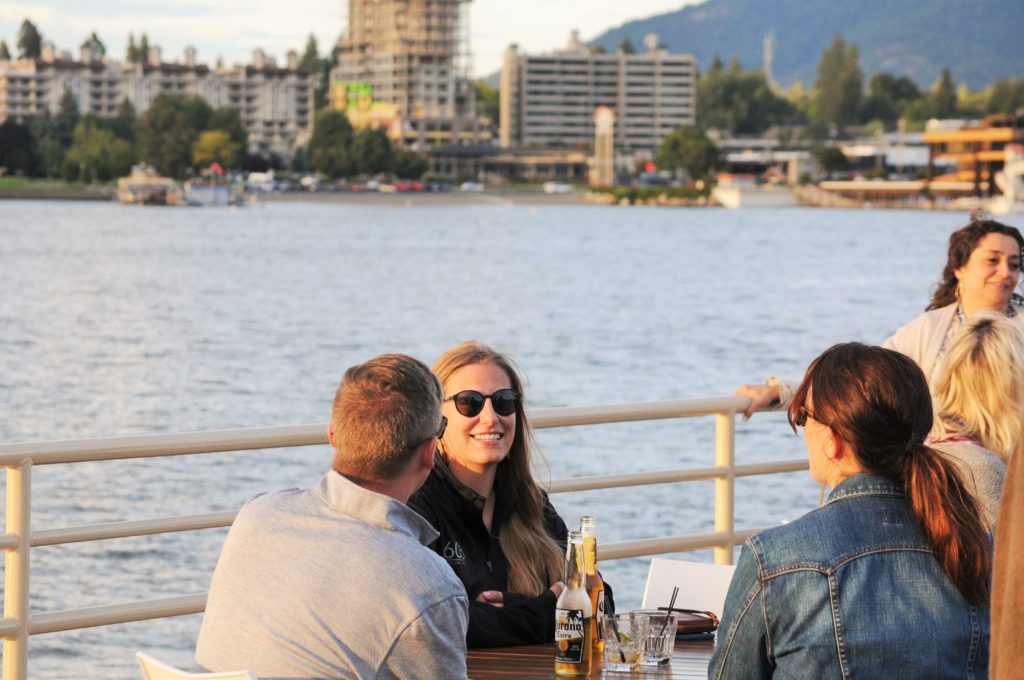 Group of people enjoying lake cruise on Coeur d' Alene Lake
