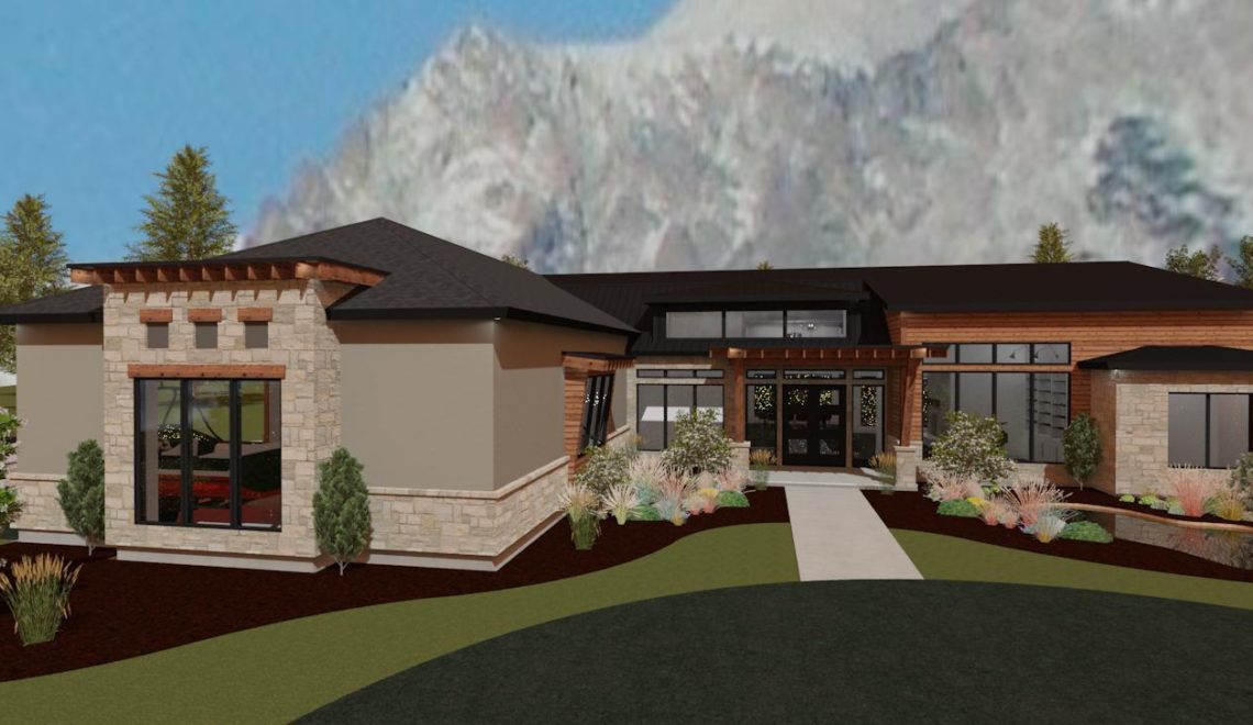 Modern mountain home design with tan stucco and brick accents.