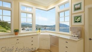 A light airy kitchen with a continuous glass corner window overlooking the ocean.