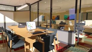 A conference room with large glass windows overlooks works spaces and is energized with bright carpet tiles and vibrant artwork.