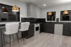 Kitchen space with dark cabinetry and hexagon backsplash
