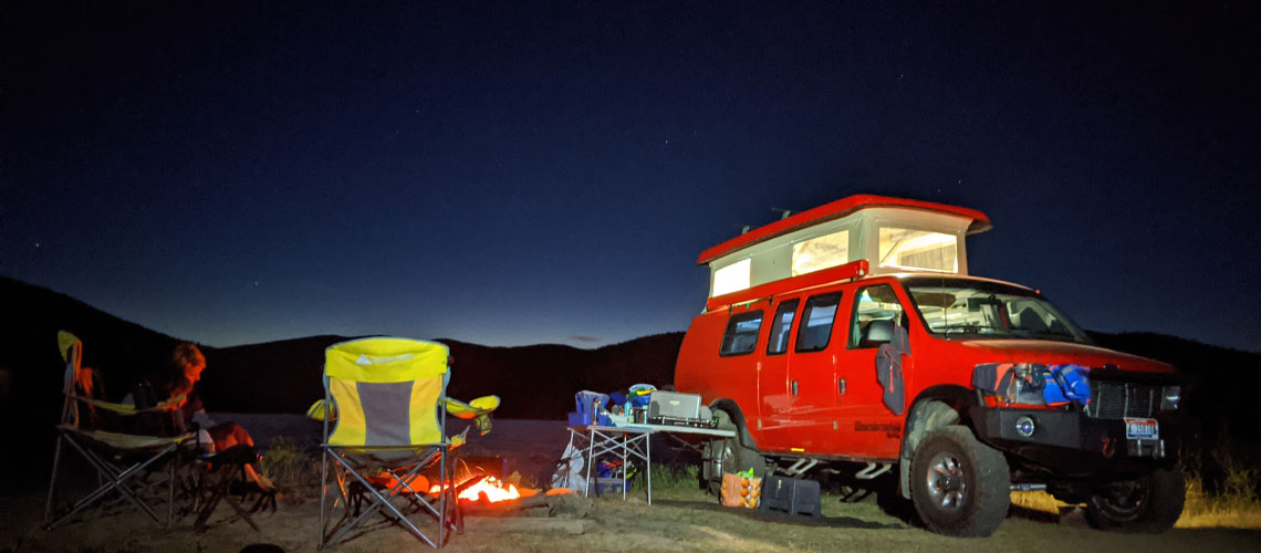 The Pedersens van, a 2001 Ford E350 extended body Sportsmobile with penthouse pop top and a Quigley 4X4 conversion.